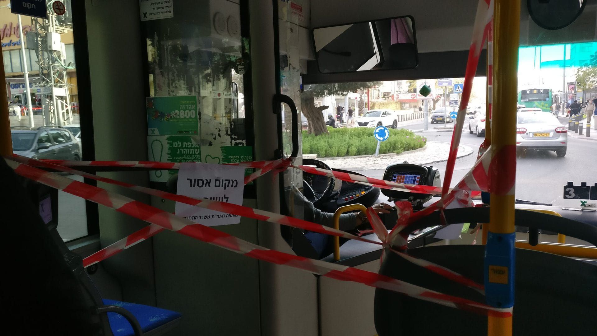 A bus in Jerusalem with its front door blocked, following coronavirus fears